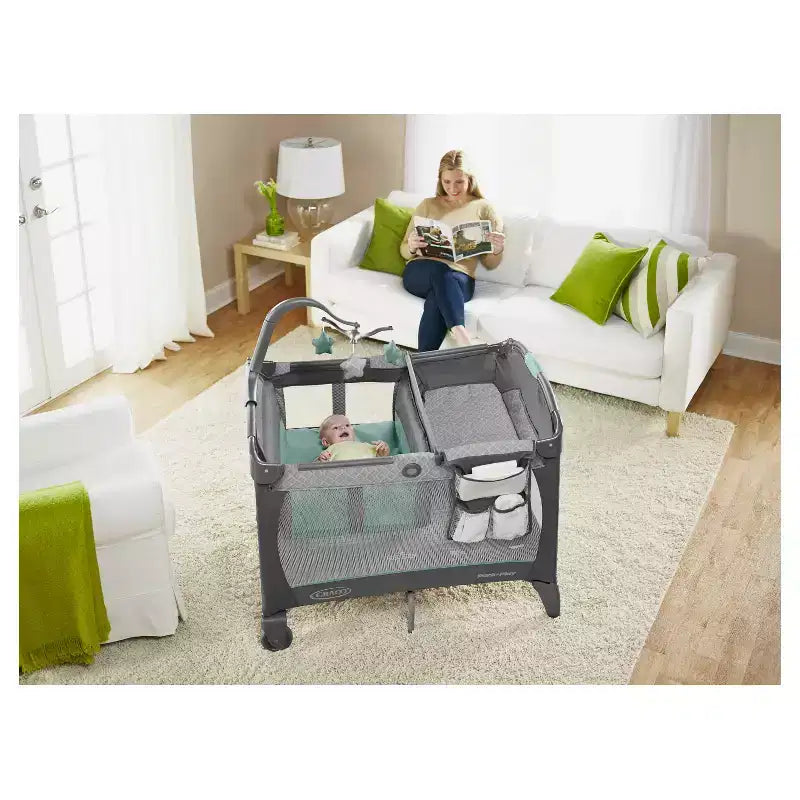 Graco Pack 'n Play Change 'n Carry Playard - Manor: Locking Wheels, Changing Table, Baby Mobile, Carrying Bag