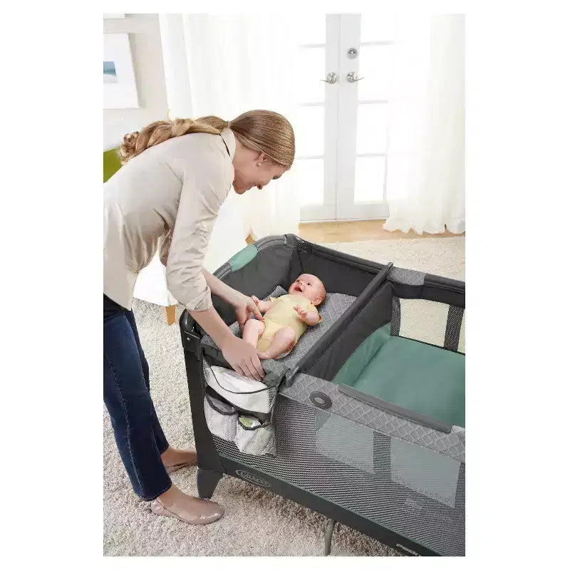 Graco Pack 'n Play Change 'n Carry Playard - Manor: Locking Wheels, Changing Table, Baby Mobile, Carrying Bag