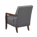 Poltrona Okak Comfy in pelle con accenti, poltrona da salotto contemporanea con cuscino trapuntato imbottito, poltrona in legno con finitura noce