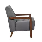 Poltrona Okak Comfy in pelle con accenti, poltrona da salotto contemporanea con cuscino trapuntato imbottito, poltrona in legno con finitura noce