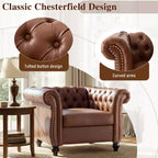 Poltrona Chesterfield Zeus e Ruta con braccioli arrotolati, finiture con borchie e gambe in legno massello