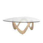 Olivia & May Cement Abstract Coffee Table with Abstract Wavy Base and Triangular Glass Top Beige
