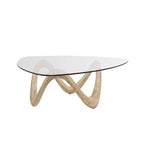 Olivia & May Cement Abstract Coffee Table with Abstract Wavy Base and Triangular Glass Top Beige