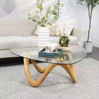 Olivia & May Cement Abstract Coffee Table with Abstract Wavy Base and Triangular Glass Top Beige