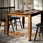 Tavolo da pranzo in legno Merrick Lane con gambe scolpite