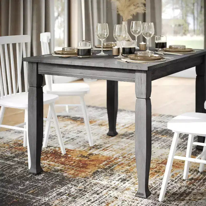 Tavolo da pranzo in legno Merrick Lane con gambe scolpite
