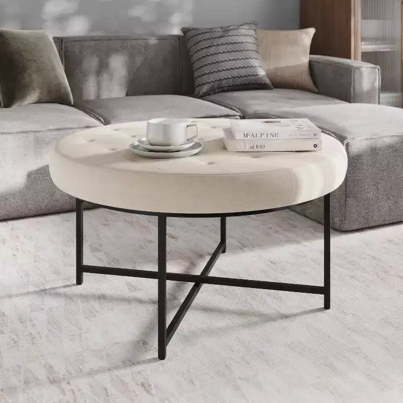 Emma and Oliver 34 in. Cotton Linen Round Ottoman with Tufted Design and Sturdy Iron Frame