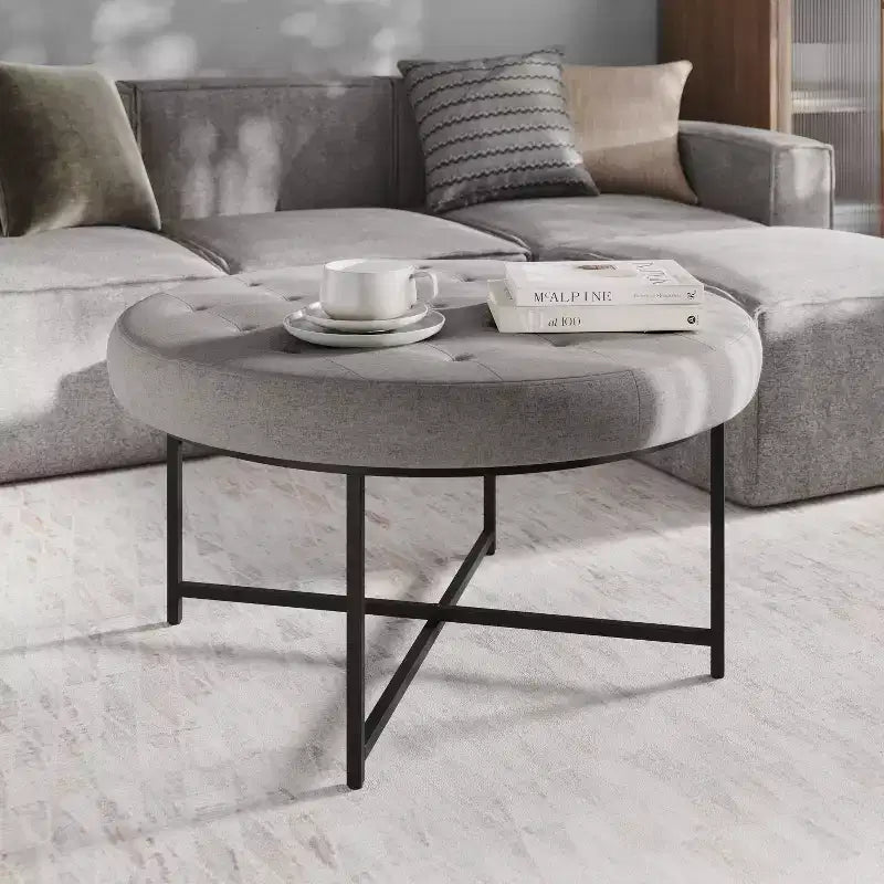 Emma and Oliver 34 in. Cotton Linen Round Ottoman with Tufted Design and Sturdy Iron Frame